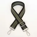 Macro detail of adjustable woven shoulder strap with green and khaki chevron pattern - Black Edge Green + Silver Hook
