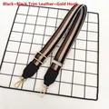 Detail of adjustable stripe bag strap with black leather ends and gold metal hook - Black Stripe with Black Leather and Gold Hook