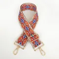 Close-up of geometric embroidered bag strap with orange and blue patterns and gold clips - Style B104 (Gold Hook)