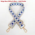 Detail view of woven bag strap featuring blue diamond pattern and gold metal hardware - Beige Base White Blue + Gold Hook