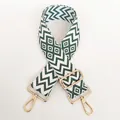Detail of adjustable nylon bag strap with green geometric pattern and gold metal hooks - White Base Green + Gold Hook