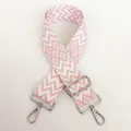 Close-up of pink wave pattern nylon bag strap with silver metal swivel lobster hooks - White Base Pink + Silver Hook