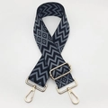 Close-up of durable nylon woven bag strap with geometric patterns and gold metal hooks - Black Base Grey + Gold Hook