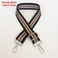 Detail of adjustable canvas strap with retro black texture and red-green stripe pattern - Vintage Black + Silver Hook