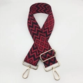 Close-up of adjustable red and black geometric pattern strap with gold metal hooks - Black Base Red + Gold Hook