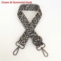 Detail view of off-white leopard print bag strap with gunmetal hooks and adjustment buckle - Cream White + Gunmetal Hook