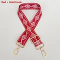 Close-up of red and white geometric woven shoulder strap with gold metal swivel hooks - Red + Gold Hook