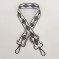 Close-up of off-white wide bag strap with geometric pattern and gunmetal metal hooks - Cream White + Gunmetal Hook