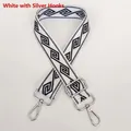 Detail of adjustable nylon strap with black and white geometric pattern and silver hook - White + Silver Hook