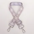 Detail view of the wide woven strap in light purple with geometric patterns and silver hooks - Light Purple + Silver Hook