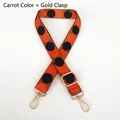 Close-up of wide woven carrot orange strap with black polka dots and gold metal hooks - Carrot Orange + Gold Hook