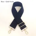 Close-up of adjustable blue canvas strap with gold metal lobster swivel hooks - Gun Black Hook / Blue
