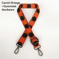 Close-up of adjustable polka dot bag strap with gunmetal clasps in carrot orange color - Carrot Orange + Gunmetal Hook