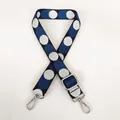 Close-up of adjustable woven shoulder strap with blue and white polka dots and silver hooks - Black Base White-Blue + Silver Hook
