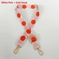 Detail of adjustable canvas strap with pink and orange polka dots and gold hooks - White-Pink + Gold Hook