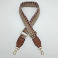 Close-up of ethnic woven strap with geometric patterns and golden metal buckles - Silver Hook / Khaki Brown / Brown Leather