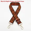 Detail of black and orange geometric canvas strap with golden metal lobster clasps - Silver Hook / Black Base Bright Orange