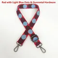 Detailed view of red and light blue wave patterns on woven adjustable canvas bag strap - Red Base Light Blue + Gunmetal Hook
