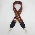Detail of bohemian woven bag strap with geometric patterns and gold metal clasps - Silver Hook / Orange Black Red / Black Leather