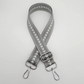 Detail of adjustable grey nylon strap with white arrow pattern and silver metal clasps - Grey + Silver Hook
