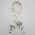 Close-up of adjustable nylon strap with golden arrow embroidery and silver metal lobster clips - White + Silver Hook