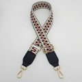 Detail of adjustable woven bag strap featuring red and black geometric tribal patterns - Silver Hook / Light Grey Black Red / Black Leather