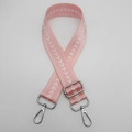 Detailed view of pink nylon bag strap with white arrow embroidery and silver metal hooks - Pale Pink + Silver Hook
