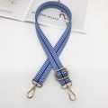 Detailed macro view of adjustable blue and white striped canvas strap with gold metal hooks - Lake Blue And White With Gold Hook