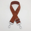 Close-up of adjustable wide canvas shoulder strap with brown Greek key pattern - Brown (Silver Hook)