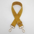 Detail view of mustard yellow canvas bag strap with geometric patterns and gold buckle - Yellow (Gold Hook)
