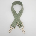 Detail of adjustable bean green canvas bag strap with gold metal buckle and geometric pattern - Matcha Green (Gold Hook)