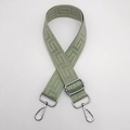 Detail of sage green nylon bag strap featuring geometric jacquard and silver hardware - Matcha Green (Silver Hook)