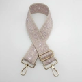 Detail of adjustable pink and beige diamond pattern jacquard canvas bag strap with gold metal hooks - Beige and Nude Pink With Gold Hook