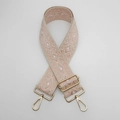 Close-up of diamond pattern nylon bag strap with golden metal swivel hooks and buckles - Beige and Pastel Pink With Gold Hook