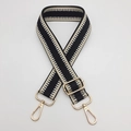 Detail of adjustable woven bag strap with geometric patterns and gold metal hooks - Gold Hook / Black