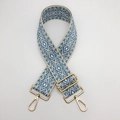 Close-up of adjustable woven purse strap with blue and beige diamond patterns and gold hooks - Beige and Blue With Gold Hook