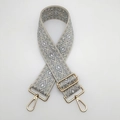 Detail of adjustable nylon strap with grey diamond pattern and gold metal lobster clasps - Beige Grey Gold Hook