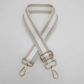 Detail of adjustable woven bag strap with geometric gold wave pattern and metal buckles - Gold Metal Hook / Apricot Edge White