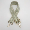 Close-up of adjustable green diamond pattern nylon strap with gold metal hardware - Beige and Matcha Green With Gold Hook