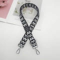Detail of adjustable black and white geometric canvas bag strap with silver metal swivel hooks - Universal Silver Hook