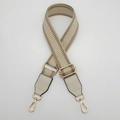 Detail of adjustable woven canvas strap with silver metallic thread and gold swivel hooks - Cream Beige