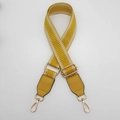 Detail of yellow and white woven bag strap with golden swivel snap hooks and leather ends - Yellow