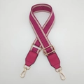 Detail of adjustable chevron woven canvas bag strap with gold metal hooks and leather trim - Rose Red with Rose Red Leather