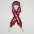 Detail of red and white geometric woven strap with gold metal buckles and leather ends - Gold Hook / Wine Red/Wine Red Leather