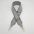 Detail of grey honeycomb woven bag strap with adjustable gold buckle and leather ends - Gold Hook / Gray with Silver Thread/Gray Leather