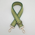 Detail of adjustable woven bag strap with green diamond pattern and gold metal hooks - Grass Green Edge Beige + Gold Hook