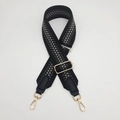 Detail of 5cm wide geometric woven strap with gold metal hooks and black leather - Gold Hook / Gray with Black Border/Black Leather