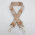 Close-up of bohemian chevron pattern bag strap with adjustable golden metal hardware - Lotus Pink + Gold Hook