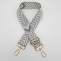 Detail of adjustable geometric weave bag strap with gold lobster clasps and grey waves - Dark Gray Apricot + Gold Hook