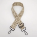 Close-up of adjustable woven shoulder strap with geometric patterns and metal hooks - Khaki Gold Thread Arrow + Gunmetal Hook